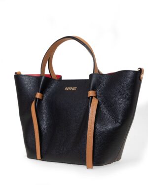 Handcrafted in Italy from the finest genuine pebbled Italian leather, this exquisite bag exudes refinement and modern grace. The exclusive Noir Tan colorway – a midnight-black exterior accented by rich tan handles and trim – creates a striking two-tone contrast that is both classic and fashion-forward.