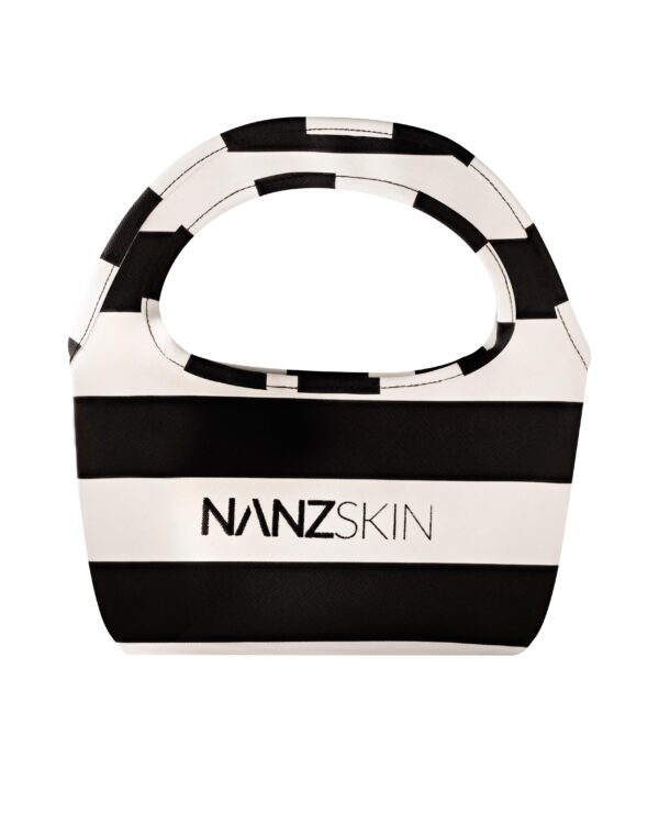 The NANZSKIN RIVIERA POUCH embodies the pinnacle of sophisticated beauty organization. This architecturally inspired masterpiece transcends ordinary storage, becoming an essential companion for the discerning skincare connoisseur. Meticulously crafted in our signature monochrome palette, this limited-edition pouch represents the intersection of European luxury and clinical precision—where form meets function in perfect harmony.